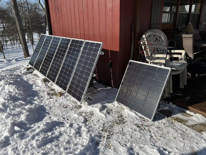 Solar panels power a snowy off-grid cabin, enabled by LiTime lithium batteries