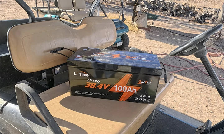 litime lithium golf cart battery customer review: a LiTime 38.4V 100Ah battery rests on a golf cart seat